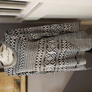 One World shark bite sweater